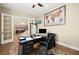 Inviting office space with natural light, hardwood floors, and an ergonomic setup for productivity and comfort at 5523 Kyle Peak Ct, Las Vegas, NV 89135