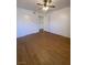 A bright bedroom featuring a ceiling fan and wood-look floors, offering a cozy, modern living space at 555 E Silverado Ranch Blvd # 1069, Las Vegas, NV 89183