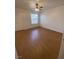 Sunlit bedroom with wood flooring and a ceiling fan, creating a warm and inviting atmosphere at 555 E Silverado Ranch Blvd # 1069, Las Vegas, NV 89183