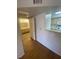 Hallway view leading to the kitchen and bathroom area, complemented by wood flooring at 555 E Silverado Ranch Blvd # 1069, Las Vegas, NV 89183