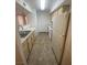 Galley-style kitchen with stainless steel sink, and lots of cabinet space at 555 E Silverado Ranch Blvd # 1069, Las Vegas, NV 89183