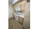 Kitchen featuring white appliances, and laminate countertops, with overhead microwave at 555 E Silverado Ranch Blvd # 1069, Las Vegas, NV 89183
