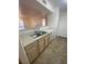 Kitchen with laminate countertop, double sink, and a partial view of the living room at 555 E Silverado Ranch Blvd # 1069, Las Vegas, NV 89183