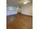 Open-concept living room leading into the kitchen area with hardwood floors throughout at 555 E Silverado Ranch Blvd # 1069, Las Vegas, NV 89183