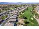 Expansive aerial view of a home next to a golf course in a well-maintained community at 5618 E San Marco Dr, Pahrump, NV 89061