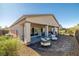Spacious backyard featuring patio with seating and a well-maintained landscape at 5618 E San Marco Dr, Pahrump, NV 89061
