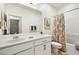 Clean bathroom with a single sink vanity, tub-shower combo, and decorative shower curtain at 5618 E San Marco Dr, Pahrump, NV 89061