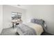 Cozy bedroom with a comfortable bed, a functional desk, and a view of the neighborhood at 5618 E San Marco Dr, Pahrump, NV 89061