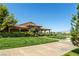 Attractive clubhouse with lush landscaping, offering a welcoming entrance and well-manicured surroundings at 5618 E San Marco Dr, Pahrump, NV 89061