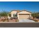 Well-maintained single-story home boasts desert landscaping and an attached two-car garage at 5618 E San Marco Dr, Pahrump, NV 89061