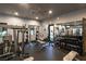 Fully equipped fitness center featuring weights, machines, and mirrors for a complete workout experience at 5618 E San Marco Dr, Pahrump, NV 89061