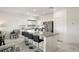 Modern kitchen with a large island and seating, stainless steel appliances and bright lighting at 5618 E San Marco Dr, Pahrump, NV 89061