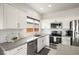 Well-equipped kitchen featuring stainless steel appliances, white subway tile backsplash, and ample counter space at 5618 E San Marco Dr, Pahrump, NV 89061