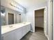 Bright bathroom boasts double sinks with modern fixtures, lots of counter space and flooring at 5720 Ruby Creek Dr, Las Vegas, NV 89142
