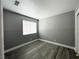 Cozy bedroom features modern flooring, a neutral color scheme and wainscoting at 5720 Ruby Creek Dr, Las Vegas, NV 89142