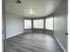 Spacious bedroom features modern flooring and plenty of natural light through large windows at 5720 Ruby Creek Dr, Las Vegas, NV 89142