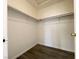 Walk-in closet features shelving and modern flooring at 5720 Ruby Creek Dr, Las Vegas, NV 89142