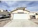 Charming single-story home featuring a wide two-car garage and a well-maintained front yard at 5720 Ruby Creek Dr, Las Vegas, NV 89142