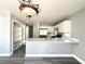 Bright kitchen featuring stainless steel appliances, modern cabinetry, and an eat-in breakfast bar at 5720 Ruby Creek Dr, Las Vegas, NV 89142