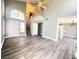 Spacious living room with vaulted ceilings, a staircase, and hardwood style floors at 5720 Ruby Creek Dr, Las Vegas, NV 89142