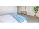 Bright bedroom with a stylish bed, light-colored walls and decorative furniture pieces at 6112 Aster Garden St # 131, North Las Vegas, NV 89081