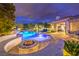 Inviting backyard with pool, spa, fire pit, and lounge seating perfect for outdoor entertaining at 62 Grand Masters Dr, Las Vegas, NV 89141