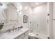 Chic white bathroom with glass shower door and elegant fixtures at 62 Grand Masters Dr, Las Vegas, NV 89141