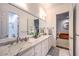 Bathroom featuring double sinks and a marble countertop at 62 Grand Masters Dr, Las Vegas, NV 89141