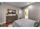 Cozy bedroom with a dresser and a large television at 62 Grand Masters Dr, Las Vegas, NV 89141