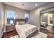 Comfortable bedroom with hardwood floors, neutral walls, and ample natural light at 62 Grand Masters Dr, Las Vegas, NV 89141