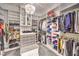 Spacious walk-in closet with custom shelving and a decorative chandelier at 62 Grand Masters Dr, Las Vegas, NV 89141