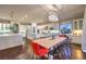 Spacious dining area featuring modern lighting, seating for 10, and kitchen access at 62 Grand Masters Dr, Las Vegas, NV 89141