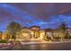 Charming single story home with stone accents, a three car garage and manicured landscaping at 62 Grand Masters Dr, Las Vegas, NV 89141