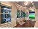 Bright foyer with wood floors, a view to the putting green and bright natural lighting at 62 Grand Masters Dr, Las Vegas, NV 89141