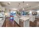 Beautiful kitchen with a large island, sleek appliances, and an open layout to the living area at 62 Grand Masters Dr, Las Vegas, NV 89141