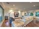 Bright living room boasts hardwood floors, recessed lighting, and a cozy seating area at 62 Grand Masters Dr, Las Vegas, NV 89141