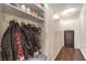 Well-organized mudroom with ample storage, coat hooks, and a convenient wine refrigerator at 62 Grand Masters Dr, Las Vegas, NV 89141