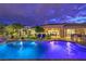 Stunning backyard pool with lounge chairs, meticulous landscaping, and relaxing ambiance at dusk at 62 Grand Masters Dr, Las Vegas, NV 89141