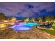 Sparkling pool and spa with stylish outdoor seating and manicured greenery at twilight at 62 Grand Masters Dr, Las Vegas, NV 89141