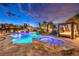 Beautiful backyard pool and spa, lounge chairs, and a covered bed create a relaxing backyard oasis at 62 Grand Masters Dr, Las Vegas, NV 89141
