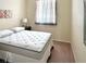 Cozy bedroom with a comfortable bed, soft carpet, and natural light from the window at 66 John Stuart Mill St, Henderson, NV 89002