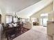 Elegant dining area with a chandelier, seating for six, and seamless access to the living room at 66 John Stuart Mill St, Henderson, NV 89002