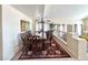Cozy dining area featuring a large table, stylish chairs, and an open layout to the living area at 66 John Stuart Mill St, Henderson, NV 89002
