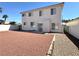 Two-story home with a spacious backyard featuring desert landscaping, providing privacy and curb appeal at 66 John Stuart Mill St, Henderson, NV 89002