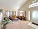 Comfortable living room with neutral tones, large windows, and a relaxing ambiance at 66 John Stuart Mill St, Henderson, NV 89002