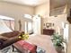 Inviting living room boasting high ceilings, a large window, and comfortable seating at 66 John Stuart Mill St, Henderson, NV 89002