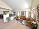 Open-concept living room featuring modern decor, a cozy seating area, and natural light at 66 John Stuart Mill St, Henderson, NV 89002