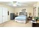 Spacious main bedroom with a ceiling fan and natural light from the windows at 66 John Stuart Mill St, Henderson, NV 89002