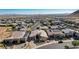 Wide aerial shot showcasing a home within a vibrant community, set against a desert and mountain landscape at 6832 Apogee Ridge Ct, Las Vegas, NV 89135