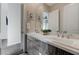 Well-lit bathroom with double sinks, wood cabinets, and a neutral color palette for a soothing ambiance at 6832 Apogee Ridge Ct, Las Vegas, NV 89135